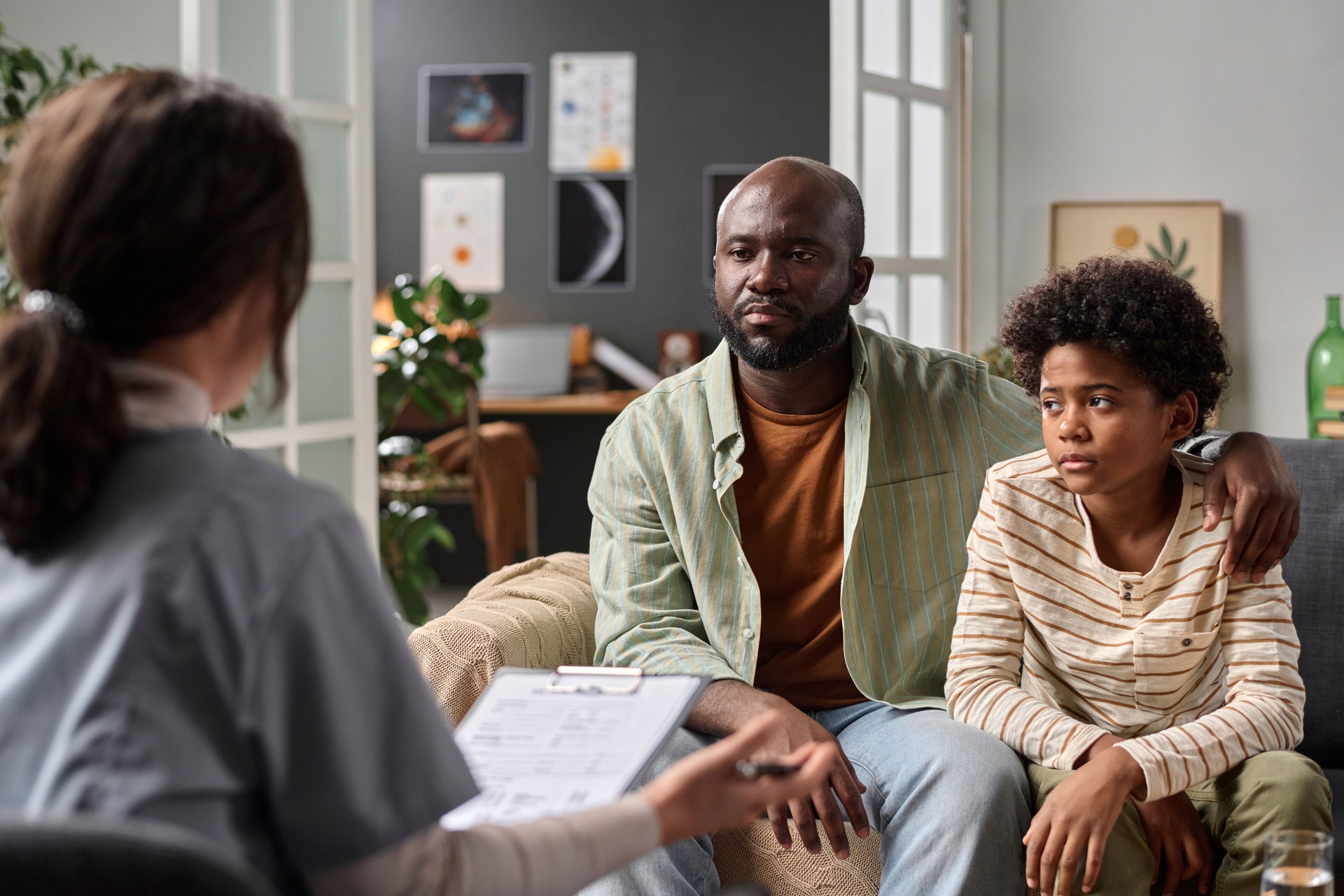 Parent and Child Listening During Family Therapy Session